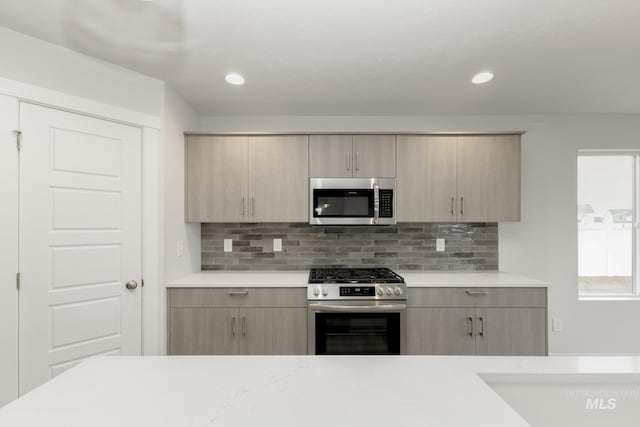 14761 N Ninja Way, Nampa, ID 83651 - kitchen featuring light brown cabinets, recessed lighting, stainless steel appliances, light countertops, and decorative backsplash