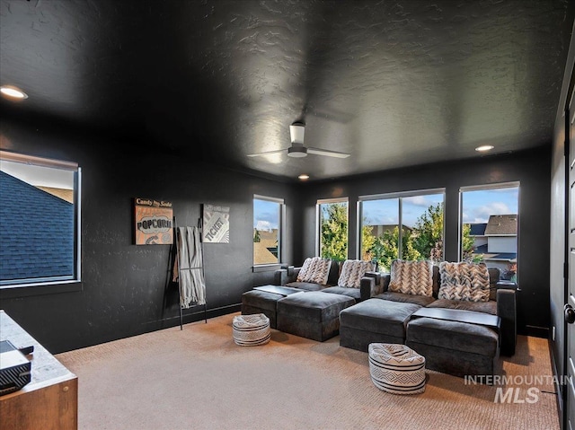 carpeted cinema with recessed lighting, a textured ceiling, and ceiling fan