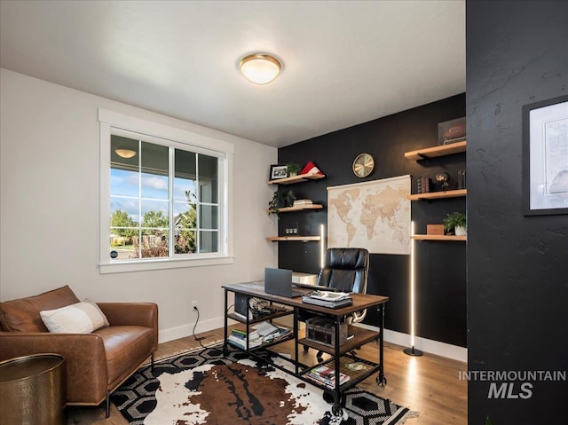 office with wood finished floors and baseboards