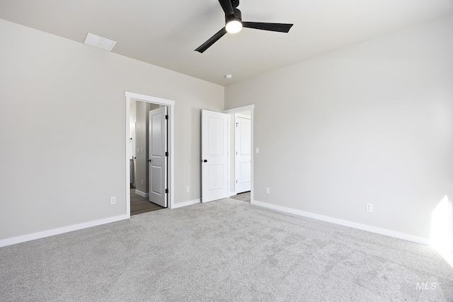 unfurnished bedroom with ceiling fan and carpet flooring