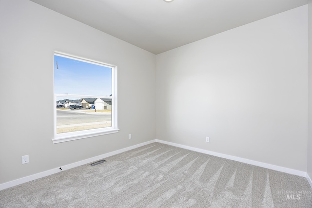 empty room featuring carpet floors