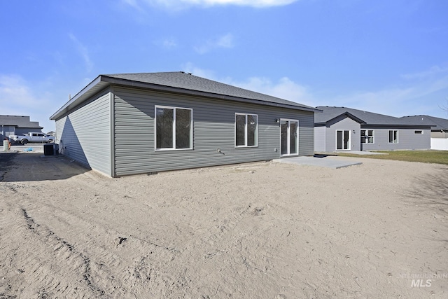 back of house with a patio and central AC