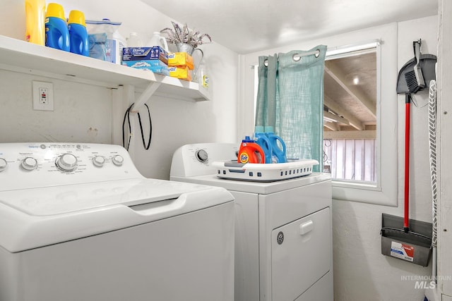 laundry room with washing machine and clothes dryer