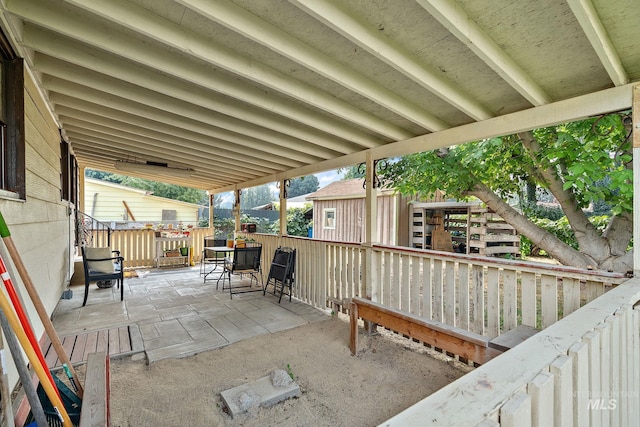 view of patio / terrace with a storage shed