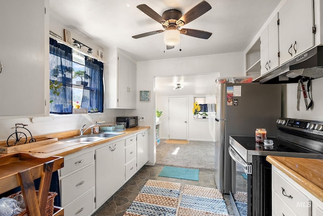 kitchen featuring ceiling fan, white cabinetry, sink, and electric range