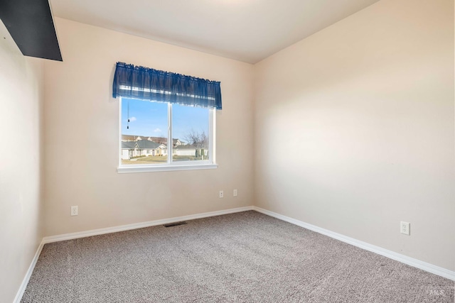 unfurnished room with carpet flooring