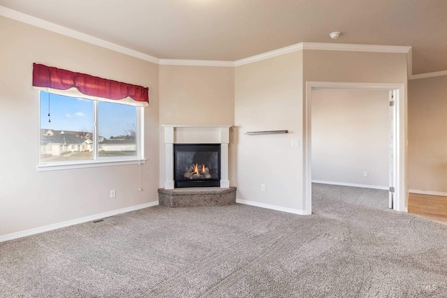 unfurnished living room with carpet flooring and ornamental molding