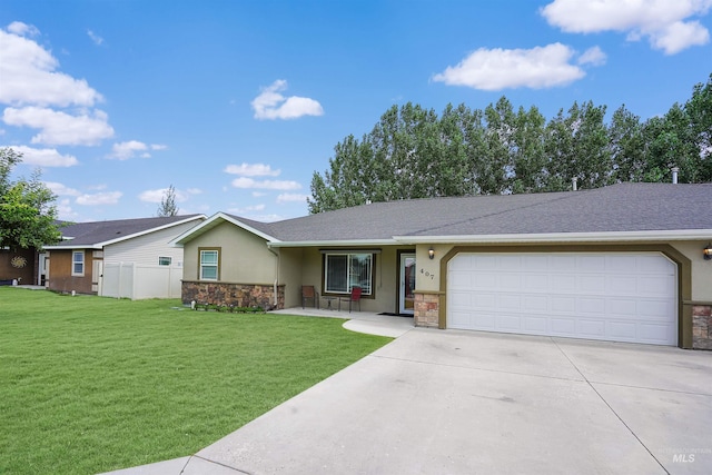 ranch-style home featuring a garage and a front lawn