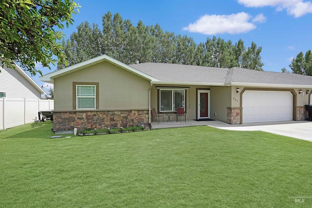 ranch-style house with a garage and a front lawn