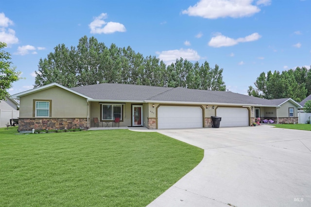 ranch-style house featuring a garage and a front lawn