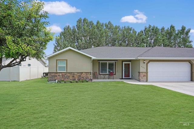 view of front facade with a garage and a front lawn