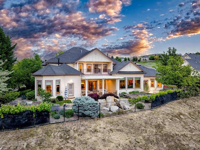 4553 N Arrow Crest Way, Boise, ID 83703 - back of property featuring board and batten siding and a patio