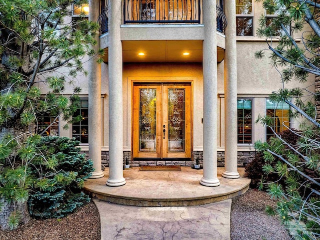 4553 N Arrow Crest Way, Boise, ID 83703 - view of exterior entry with french doors, a balcony, and stucco siding