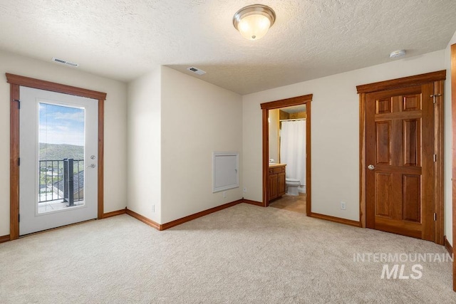 4553 N Arrow Crest Way, Boise, ID 83703 - unfurnished room featuring light colored carpet, a textured ceiling, baseboards, and a smoke detector
