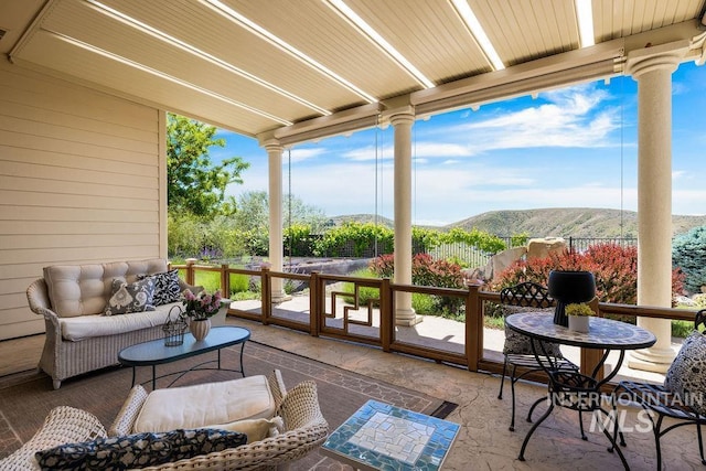 4553 N Arrow Crest Way, Boise, ID 83703 - sunroom / solarium featuring a mountain view and an outdoor hangout area