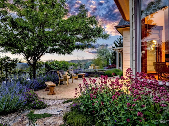 4553 N Arrow Crest Way, Boise, ID 83703 - yard at dusk featuring a patio area
