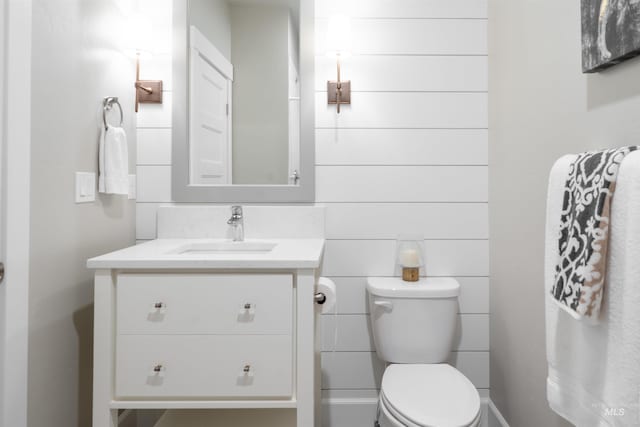 bathroom featuring toilet and vanity