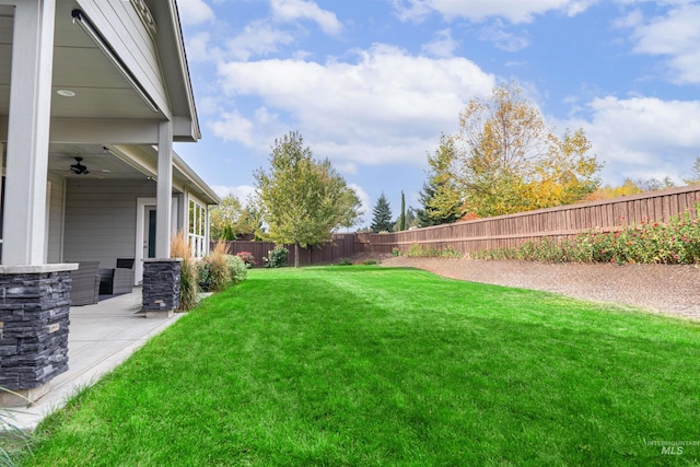 view of yard with a patio and a fenced backyard