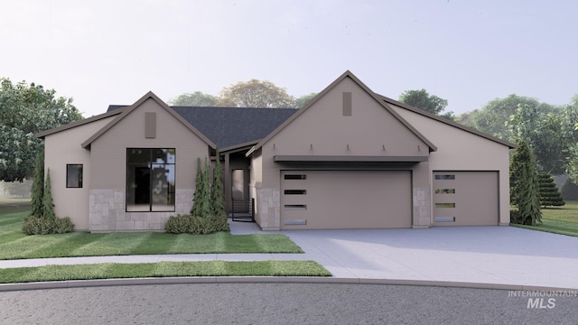 view of front of home featuring a garage, concrete driveway, and a front lawn