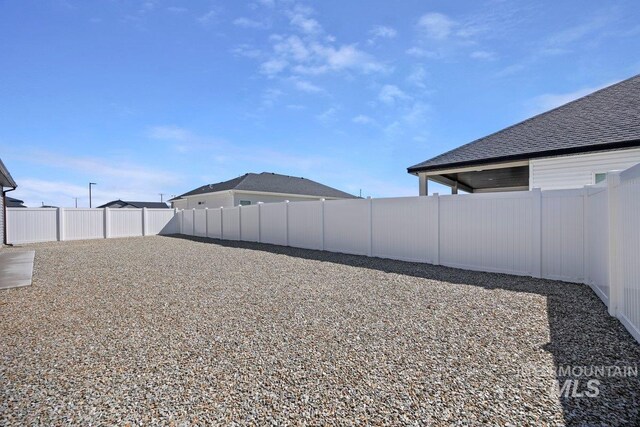 garage with a workshop area and electric panel