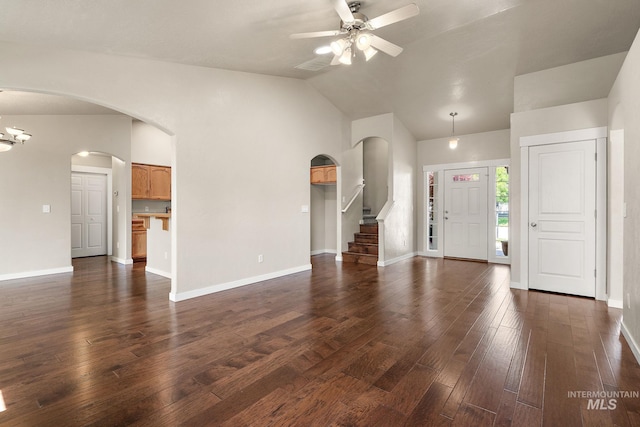613 E Sable Ridge Dr, Kuna, ID 83634 - foyer entrance featuring arched walkways, a ceiling fan, baseboards, dark wood-style floors, and high vaulted ceiling