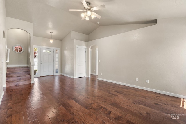613 E Sable Ridge Dr, Kuna, ID 83634 - foyer entrance with arched walkways, a ceiling fan, vaulted ceiling, dark wood-style floors, and baseboards