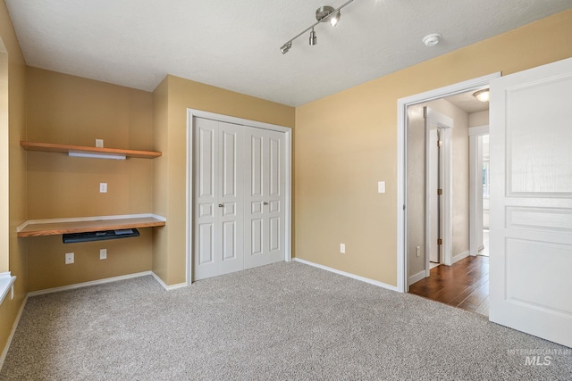 613 E Sable Ridge Dr, Kuna, ID 83634 - unfurnished bedroom featuring carpet floors, baseboards, and a closet