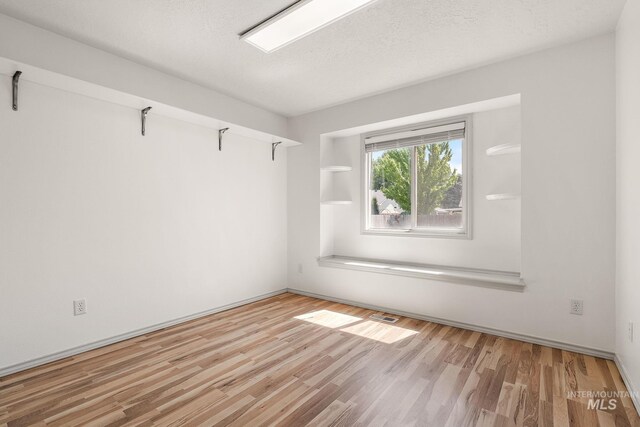 613 E Sable Ridge Dr, Kuna, ID 83634 - spare room with wood finished floors