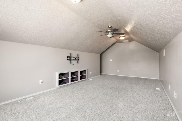 613 E Sable Ridge Dr, Kuna, ID 83634 - bonus room with a textured ceiling, carpet, lofted ceiling, ceiling fan, and baseboards