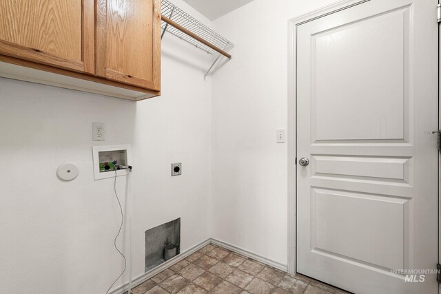 613 E Sable Ridge Dr, Kuna, ID 83634 - laundry area with cabinet space, hookup for a washing machine, electric dryer hookup, and stone finish floors
