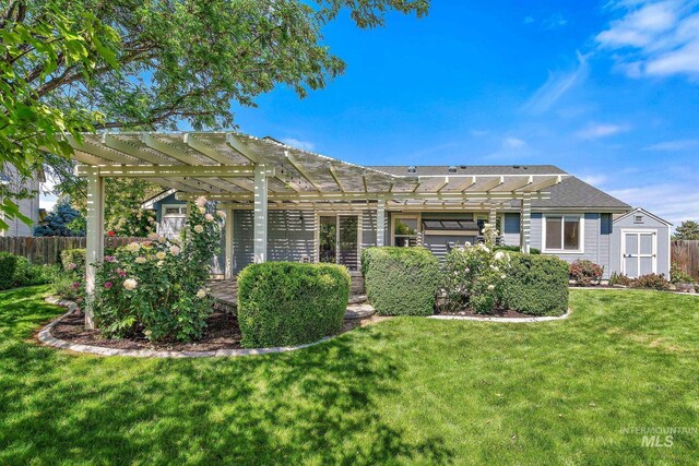 613 E Sable Ridge Dr, Kuna, ID 83634 - rear view of property with a pergola and a shed