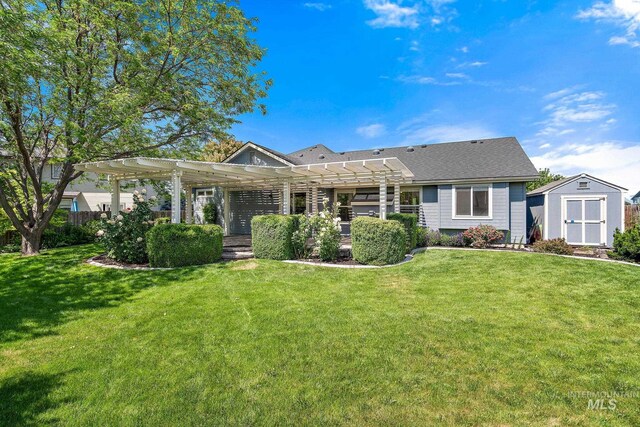 613 E Sable Ridge Dr, Kuna, ID 83634 - rear view of property with a pergola and a yard