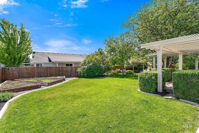 613 E Sable Ridge Dr, Kuna, ID 83634 - view of yard with a pergola and a garden