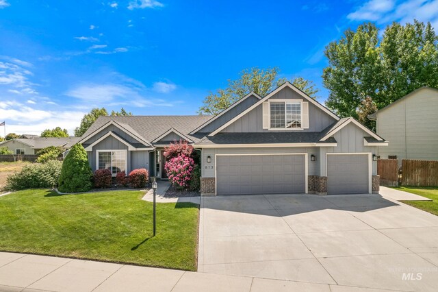613 E Sable Ridge Dr, Kuna, ID 83634 - craftsman-style home featuring board and batten siding, concrete driveway, brick siding, a shingled roof, and an attached garage