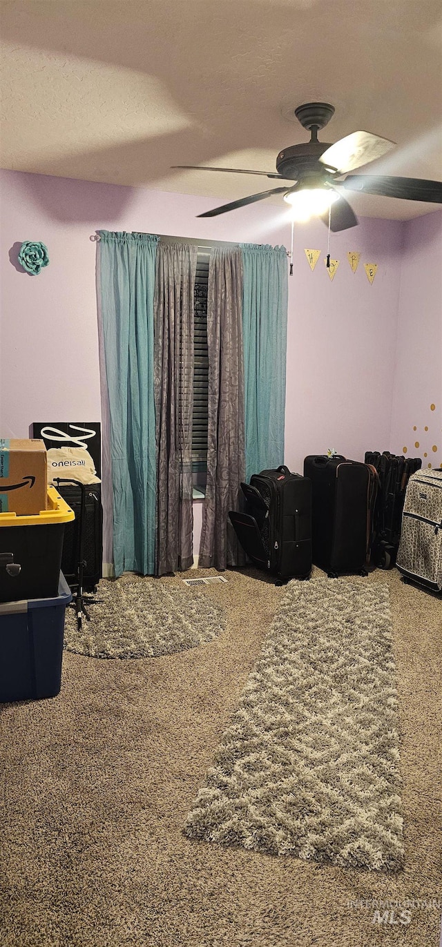 1122 N Roper Pl, Meridian, ID 83642 - carpeted bedroom with a ceiling fan