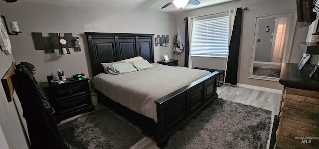 1122 N Roper Pl, Meridian, ID 83642 - bedroom with light wood-style flooring, ceiling fan, and baseboards