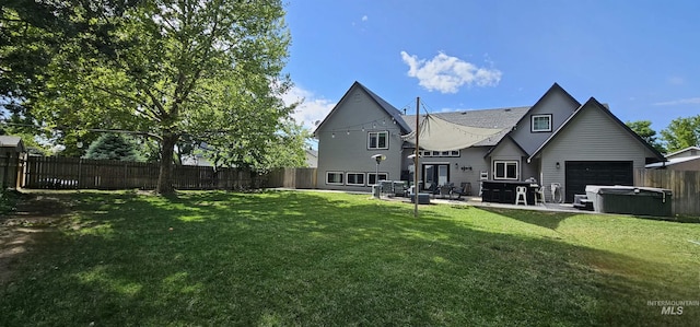 1122 N Roper Pl, Meridian, ID 83642 - rear view of property featuring a hot tub, a patio area, and an attached garage