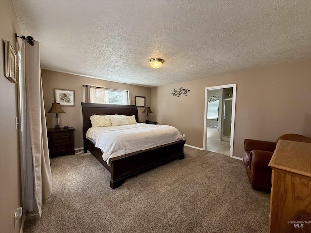 2361 N Pollard Ln, Star, ID 83669 - carpeted bedroom featuring a textured ceiling, baseboards, and ensuite bath