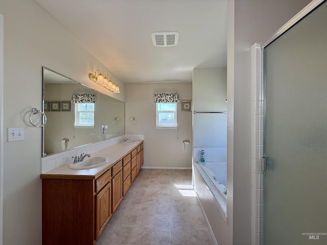2361 N Pollard Ln, Star, ID 83669 - bathroom with double vanity, a bath, baseboards, and a shower with door