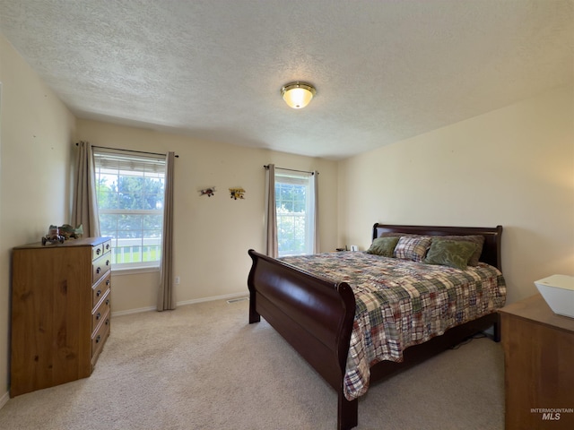 2361 N Pollard Ln, Star, ID 83669 - bedroom featuring light carpet, a textured ceiling, and baseboards