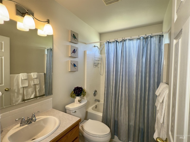 2361 N Pollard Ln, Star, ID 83669 - full bathroom with backsplash, shower / bathtub combination with curtain, toilet, and vanity