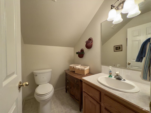 2361 N Pollard Ln, Star, ID 83669 - half bathroom with toilet, vanity, vaulted ceiling, and tile patterned floors