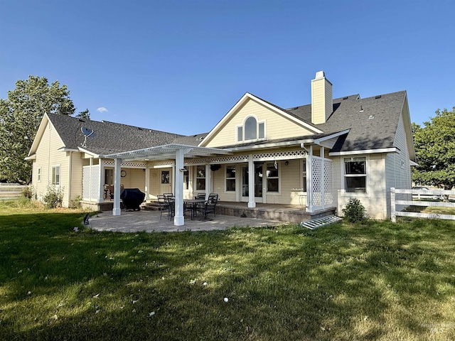 2361 N Pollard Ln, Star, ID 83669 - back of house with a lawn, a pergola, a chimney, a shingled roof, and a patio area