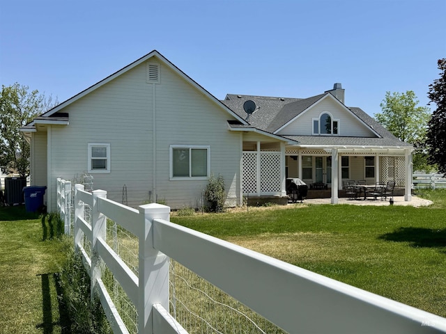 2361 N Pollard Ln, Star, ID 83669 - rear view of property featuring cooling unit, a patio, a chimney, and a shingled roof