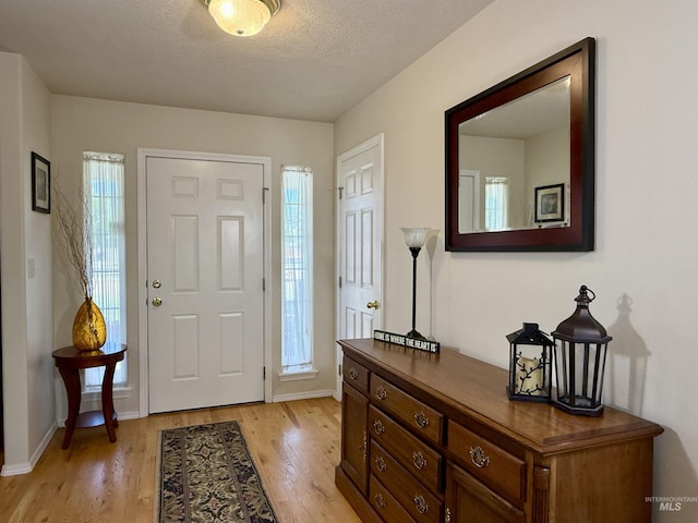 2361 N Pollard Ln, Star, ID 83669 - foyer entrance featuring light wood-style floors and baseboards