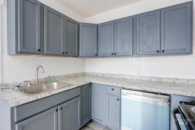 kitchen featuring range, backsplash, light stone countertops, stainless steel dishwasher, and a sink