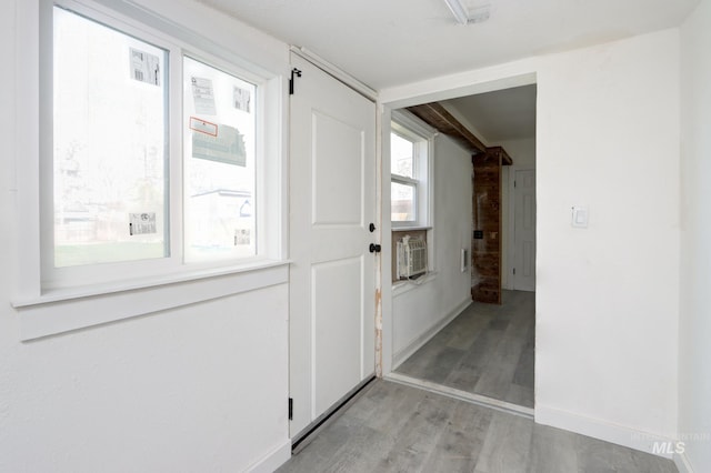 interior space with light wood-type flooring and baseboards