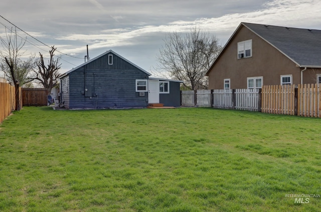 view of yard with a fenced backyard