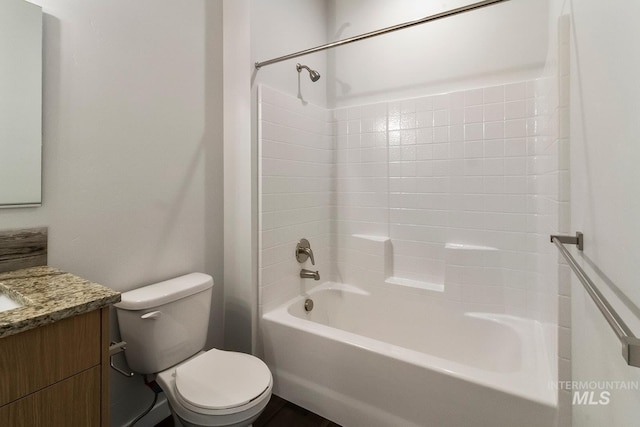 full bath featuring washtub / shower combination, toilet, and vanity