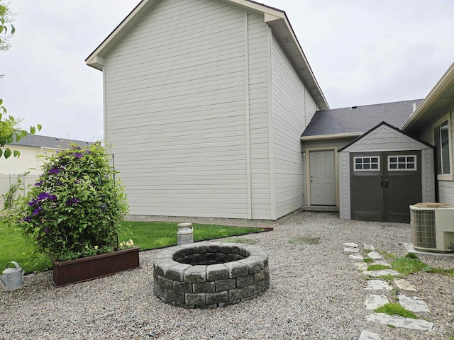 2716 Dogwood Ave, Fruitland, ID 83619 - view of side of home with a fire pit and cooling unit